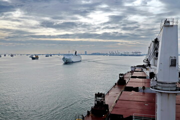 Vessels, passenger ships and tugboats in port under cargo operations and underway. Port of...