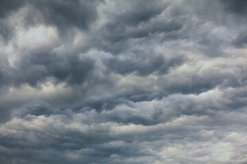 Waves clouds grey background . Windy weather sky 