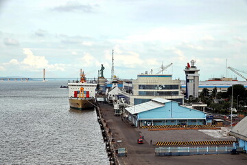 Vessels, passenger ships and tugboats in port under cargo operations and underway. Port of...