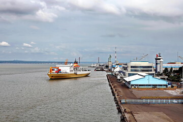 Vessels, passenger ships and tugboats in port under cargo operations and underway. Port of...