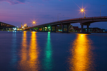 Fototapeta na wymiar River bridge at night with the lights