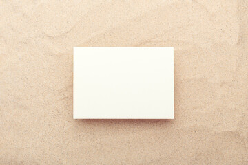Blank card mockup on sand background. Top view. Minimal design - 469056814