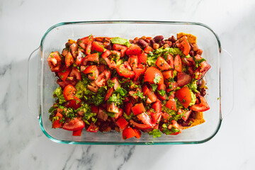 vegan nachos with corn chips bean mix guacamole and fresh tomato salsa, healthy plant-based food