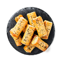 Turkish borek rolls with spinach and cheese. A traditional Turkish pastry rulo borek with black and white sesame seeds. Isolated on white background. top view