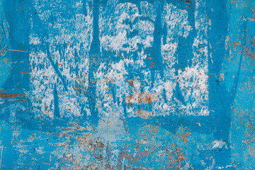 Textured message board with peeling paint and rust. Painted in blue metal rusted background.