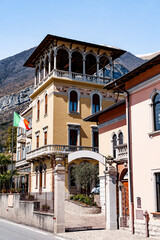 Fototapeta na wymiar Beautiful building facade with balconies and arches. Como, Italy