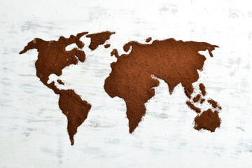 Ground aromatic coffee. Set of ground coffee in the shape of a world map. Top view.
