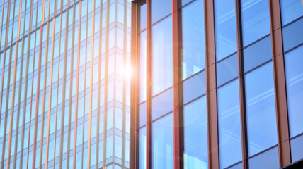  Fragment of glass and metal facade walls. Commercial office buildings. Abstract modern business architecture.