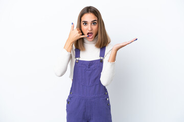 Fototapeta premium Young caucasian woman isolated on white background making phone gesture and doubting