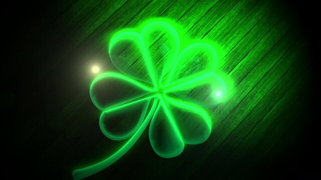Big neon green shamrocks on wood, motion holidays, Saint Patrick Day and Irish national style background