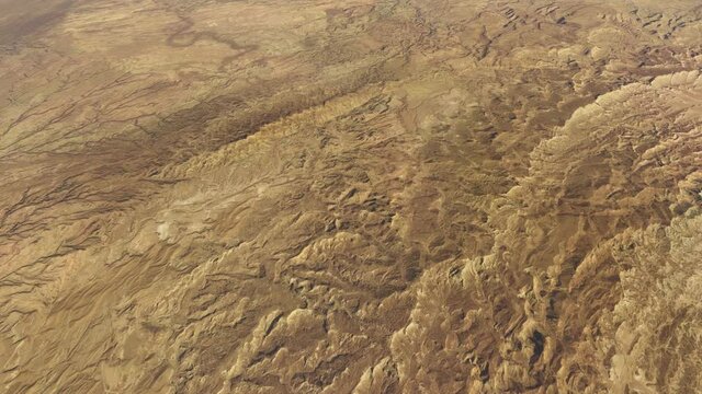 Aerial airplane view of Lut Desert widely referred to as Dasht-eLut in Persian Emptiness Plain is a large salt-desert located in the provinces of Kerman and Sistan and Baluchestan Iran 4k animation