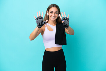 Young sport woman isolated on blue background counting nine with fingers