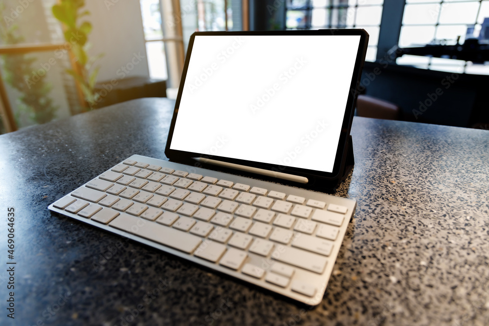 Aufkleber tablet with empty white screen in cafe tablet blank screen browsing internet or connecting
