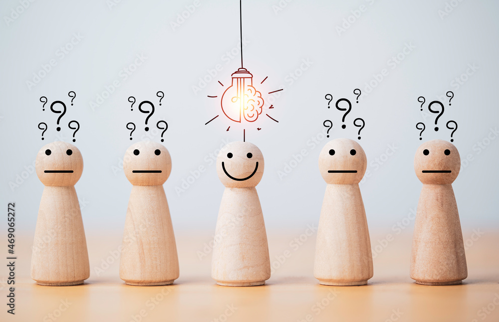 Poster smiley wooden human with light bulb and others human with question mark for creative thinking and pr