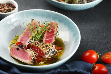 grilled tuna steak salad. Japanese traditional salad with pieces of medium-rare grilled tuna