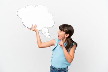 Little caucasian kid isolated on white background holding a thinking speech bubble with surprised...