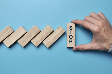 The domino fall is stopped. A symbol of support and stopping the collapse