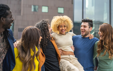 multiethinc group of friends walking and having fun together, millennials people smiling and laughing - social diversity and inclusion concept