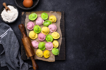 Multi colored dumplings stuffed with meat