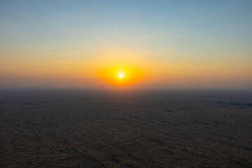 Sunrise over the Arabian Rub' al Khali Empty Quarter desert near Dubai in the United Arab Emirates