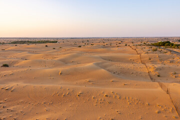 Fototapeta na wymiar Aerial view of the Dubai desert during sunrise