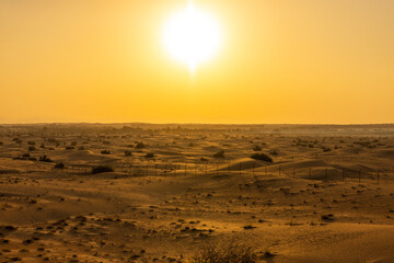 Sunrise over the Arabian Rub' al Khali Empty Quarter desert near Dubai in the United Arab Emirates