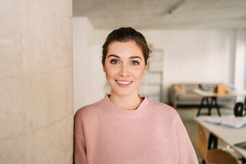 Quiet attentive young woman looking at the camera