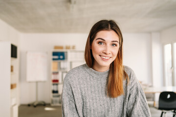 Friendly genuine businesswoman looking quizzically at camera