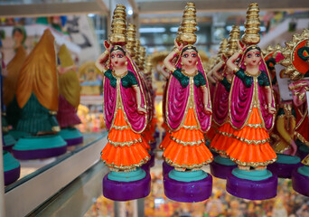 A Collection of Dolls made of clay depicting the desert state of Rajasthani girls carrying vessels of water on their heads in India.
