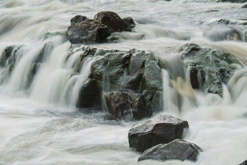 Rocks covered with the water of the mountain stream. - obrazy, fototapety, plakaty