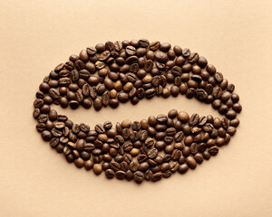 Stylized coffee bean. Styling from whole coffee beans. On a beige background. Flat lay. 