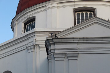 The red domed roof of the Blenduk church in the old city of Semarang. there is a pigeon perched there
