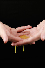 spreading chicken yolk on the palms