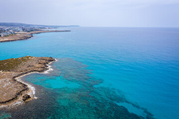 Fototapeta na wymiar Aerial view of the most famous beaches in Cyprus - Nissi Beach. White sand beach with azure waters. Beautiful beach and panoramic views of Cyprus