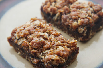 date fruit chocolate bar in a plate on table 
