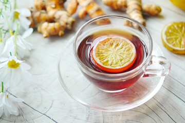 Top view of ginger tea on wooden background.