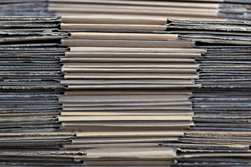 Closeup view of corrugated cardboard sheets, upcycling concept. Recyclable packaging material