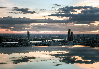 Bangkok, Thailand - Jul 04, 2021: Aerial view of Beautiful scenery view of Skyscraper Evening time Sunset creates relaxing feeling for the rest of the day. Selective focus.