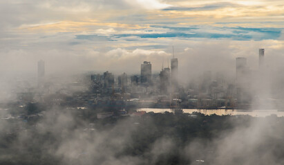 Bangkok, thailand -Sep 16, 2021 : An impressive aerial top view of skyscrapers at downtown Bangkok city along the chao phraya river in morning fog. No focus, specifically.