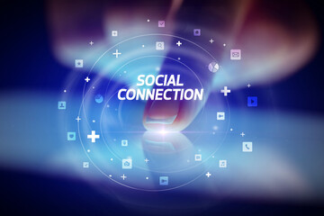 Finger touching tablet with social media icons concept