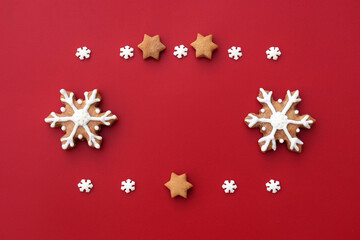 Christmas composition created from gingerbread cookies and small sugar snowflakes, copy space for text 