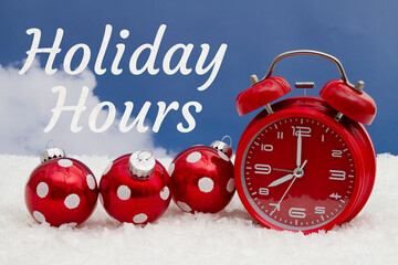 Holiday Hours message with red alarm clock, ornaments, and snow