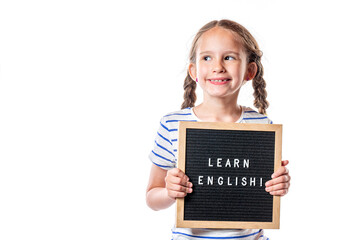 Cute little european girl with letterboard Learn English isolated on white background. English...