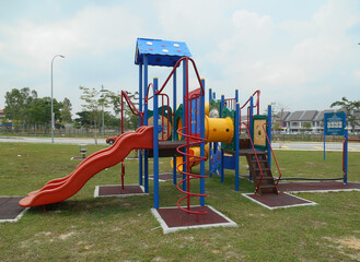 MALACCA, MALAYSIA -MAY 02, 2016: Children's outdoor playground in the public park. It was designed with a few different themes and colors to give a different experience to the kids. 