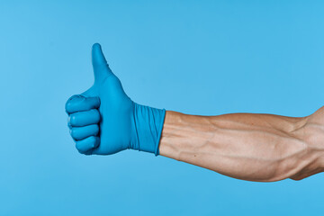 rubber gloves on the hands of a man cleaning