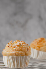 Delicious modern cruffins are made from layered croissants in the shape of a muffin Shaped like a cupcake. topping almond.