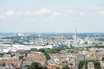 Aerial view of the Rotterdam skyline with in the background a lot of industry in the Netherlands