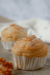 Delicious modern cruffins are made from layered croissants in the shape of a muffin Shaped like a cupcake. topping almond.
