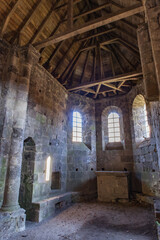 Saint Pantaléon de Lapleau (Corrèze, France) - Vue intérieure de l'ancienne église Saint-Pantaléon sur le roc du Gour noir - obrazy, fototapety, plakaty