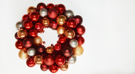 Christmas wreath on the door made of balloons. decor for decorating the interior for Christmas and New Year. Shiny multicolored balls.